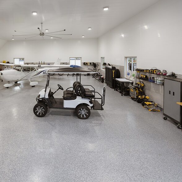 Trusscore wall&ceilingboard and slatwall white and gray installed in commercial air hangar