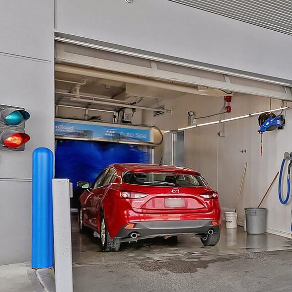 Trusscore wall&ceilingboard white installed in commercial dealership car wash