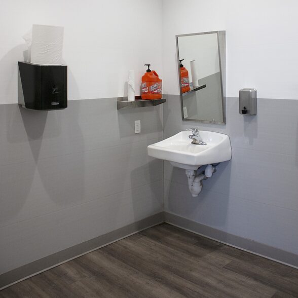 Trusscore wall&ceilingboard white and gray installed in commercial office bathroom
