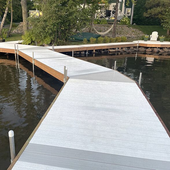 DockDeck by Trusscore white and gray installed at a waterfront cottage