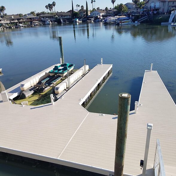DockDeck by Trusscore crosshatch grey installed on a residential dock and deck marina