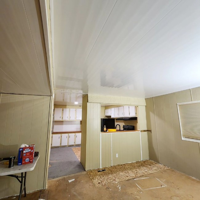 Mobile home living room featuring Trusscore