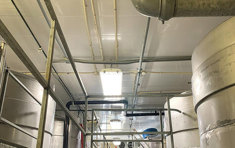 Trusscore white wall&ceilingboard installed in a brewery on the ceiling and walls