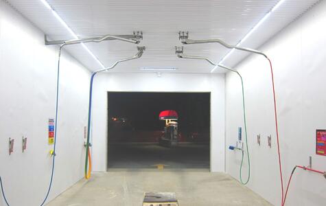 Trusscore white wallandceilingboard installed on walls and ceiling in a car wash bay