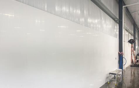 Trusscore wallandceilingboard installed on the walls of a car and truck wash