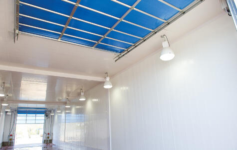 Trusscore white wallandceilingboard installed on walls and ceiling of car wash