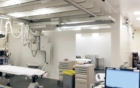 Trusscore white wallandceilingboard installed on walls and ceiling in a surgical room