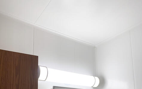 Trusscore white wall&ceilingboard installed vertically on bathroom walls with tile