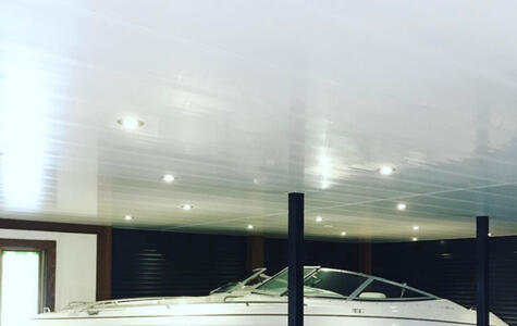 Trusscore white wall&ceilingboard installed on the ceiling in the boathouse