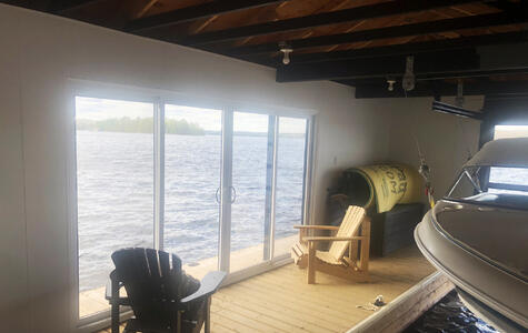 Trusscore white wall&ceilingboard installed on the walls of a boathouse