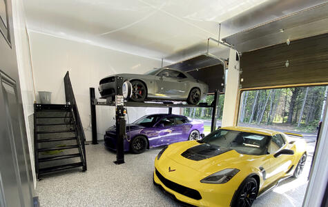 Trusscore white wall&ceilingboard installed in residential garage with a car hoist