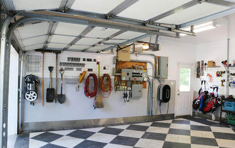 Trusscore white and gray wall&ceilingboard and slatwall installed on the walls and ceiling of the double car garage