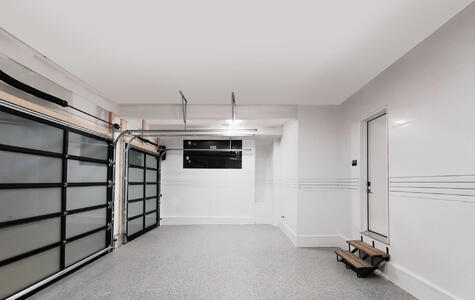 Trusscore white wallandceilingboard and slatwall installed in a garage with unfinished ceiling