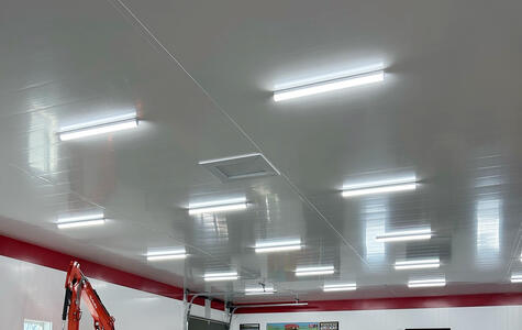 Trusscore white wall&ceilingboard installed on the walls and ceiling of a garage workshop
