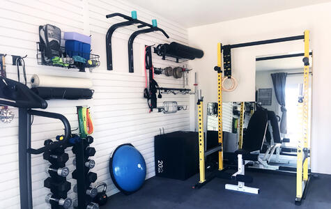Trusscore white wall&ceilingboard and slatwall installed in home gym