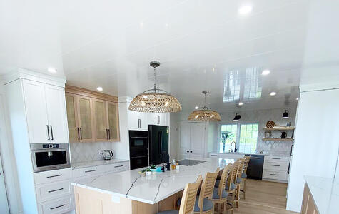 Trusscore white wallandceilingboard installed in residential kitchen ceiling